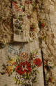 Detail view of ivory court dress showing stripes, multicolor floral brocade, lace trim and butt…