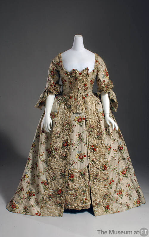Ivory striped court dress in multicolor floral brocade with lace trim, sleeve flounces, and flo…