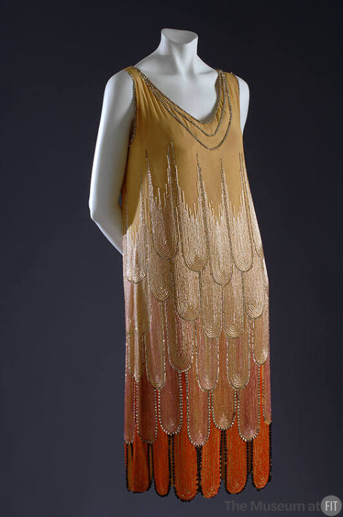 Gold sleeveless evening dress with below-the-knee skirt and ombre beaded fountain motif in whit…
