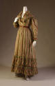 Floor length dress and matching capelet in green, yellow, red and white zigzag print with long …