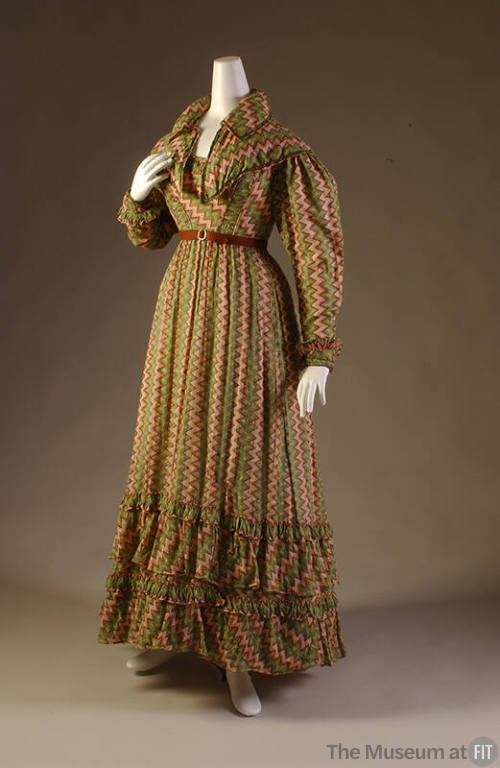 Floor length dress and matching capelet in green, yellow, red and white zigzag print with long …