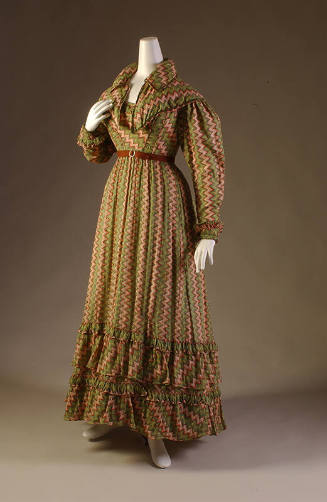 Floor length dress and matching capelet in green, yellow, red and white zigzag print with long …
