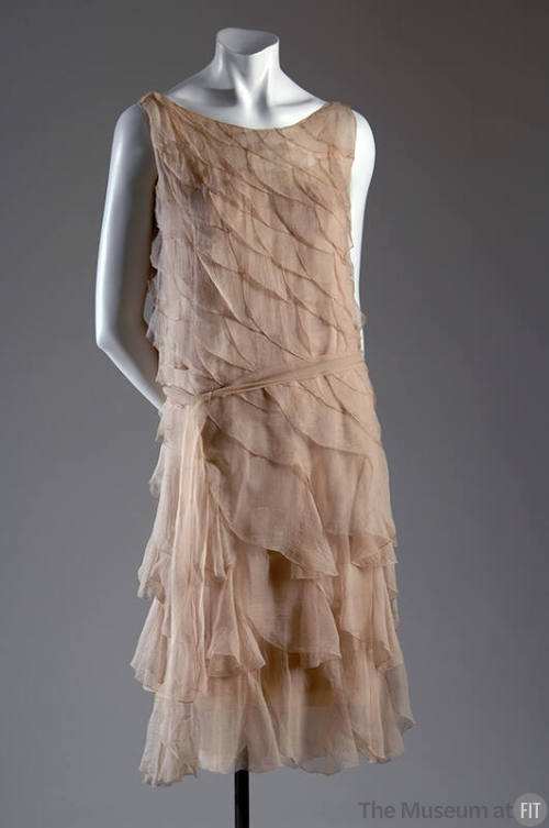 Pale pink chiffon below-the-knee length sleeveless evening dress made of graduating scalloped d…