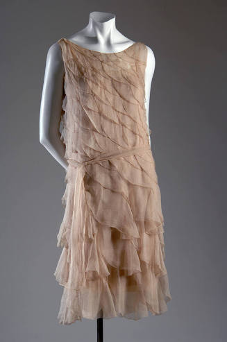 Pale pink chiffon below-the-knee length sleeveless evening dress made of graduating scalloped d…