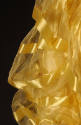 Detail view of yellow two-piece dress showing puffed silk gauze sleeve with horizontal yellow s…