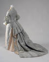 Back view of aqua blue dress showing bustle with deep pleats and long train
