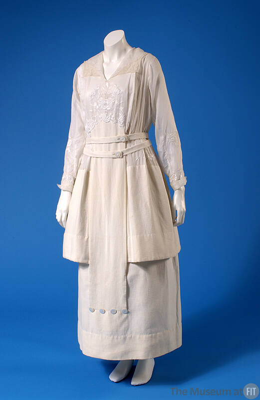 Sheer white ankle length dress with floral whitework embroidery on bodice and long sleeves and …