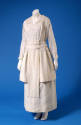 Sheer white ankle length dress with floral whitework embroidery on bodice and long sleeves and …