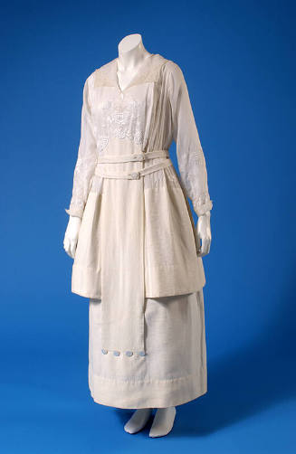 Sheer white ankle length dress with floral whitework embroidery on bodice and long sleeves and …