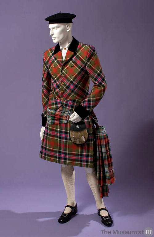 Man’s Scottish inspired tartan ensemble of triple breasted jacket, kilt, waist tie, black beret…