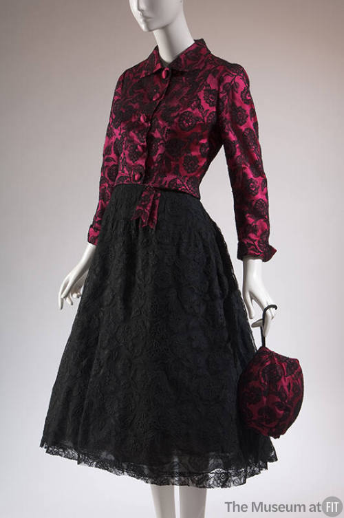 Pink satin with black floral lace overlay button front jacket, black lace below-the-knee dress …