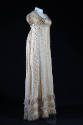 White silk openwork floor length cap sleeve dress, pink fringe trim at hem