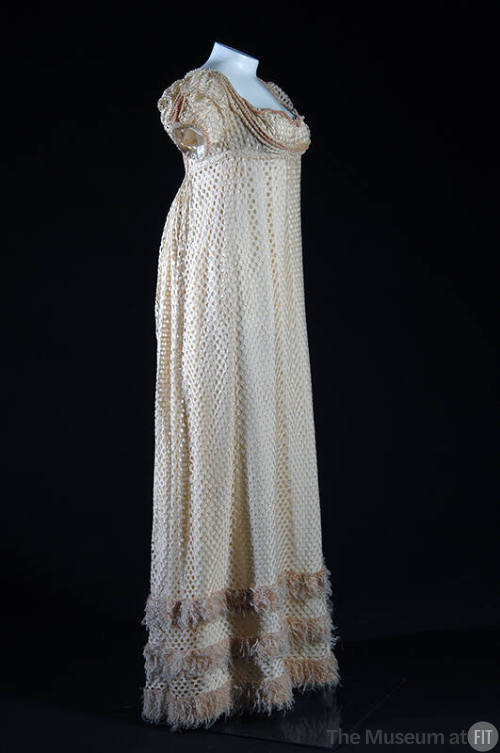 White silk openwork floor length cap sleeve dress, pink fringe trim at hem