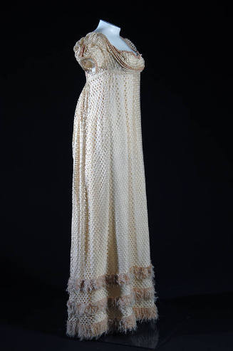 White silk openwork floor length cap sleeve dress, pink fringe trim at hem