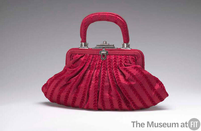 Scarlet red pleated handbag with vertical vine stripes, silver clasp and tophandle