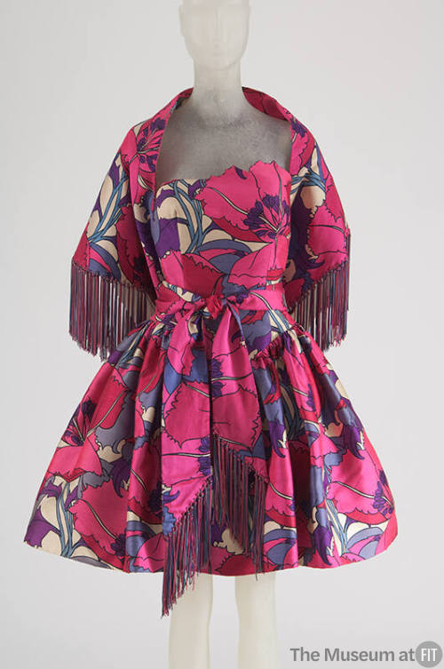 Bright pink, magenta and purple oversize floral print cocktail dress with short flared skirt an…