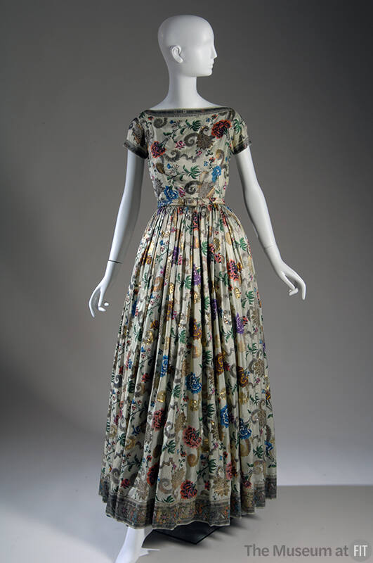 Light green floor length dress with multicolor and gold metallic embroidery, short sleeves and …