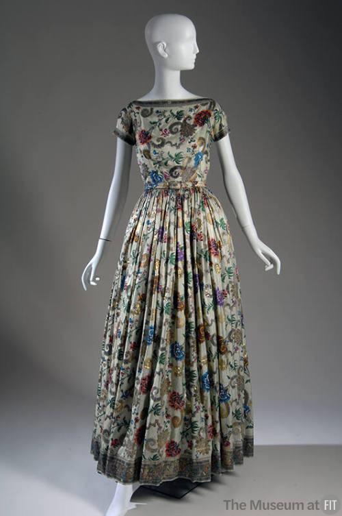Light green floor length dress with multicolor and gold metallic embroidery, short sleeves and …