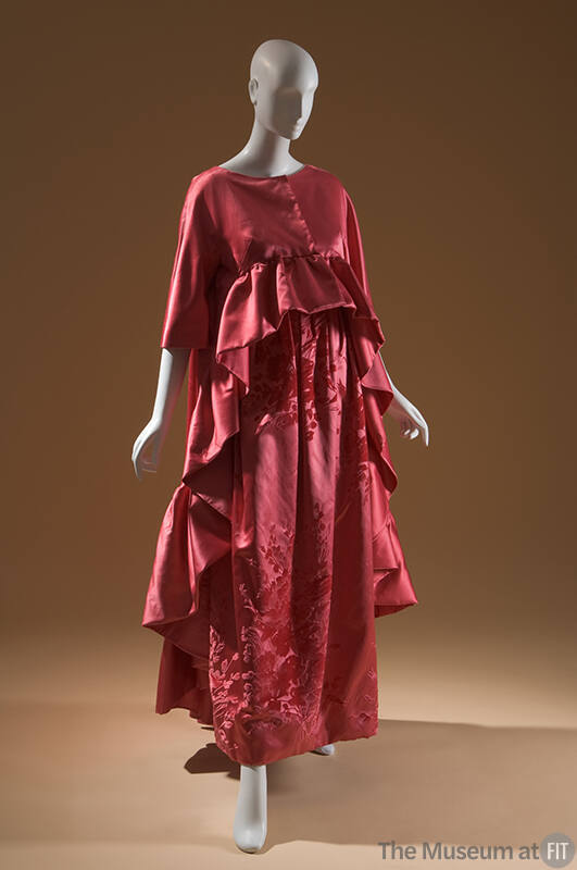 Dark pink evening gown, floral and leaf pattern and matching 3/4 sleeve coat with ruffles in fr…
