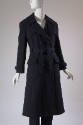 Navy blue double breasted trench coat with two flapped patch pockets, tie belt and matching pan…