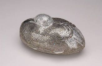 Small duck shaped handbag covered in rhinestones