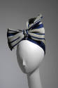 Pale green and navy blue striped turban tied in large bow