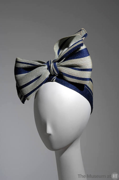 Pale green and navy blue striped turban tied in large bow
