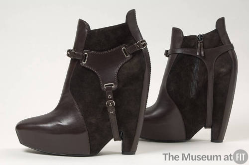 Brown leather and suede high platform ankle boot with buckle stirrups 