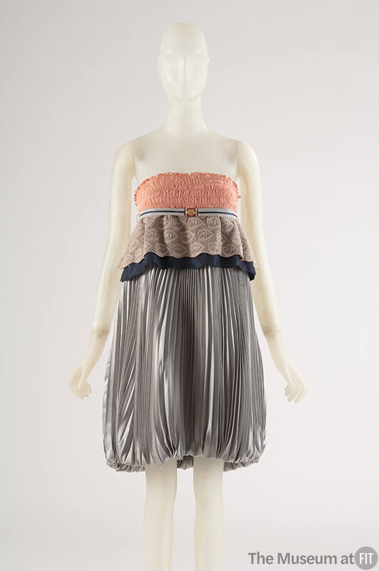 Grey pleated strapless dress with ruched orange bodice with taupe and navy lace peplum, stiped …