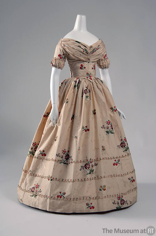 Ivory floor length gown with pink, green and brown floral motifs, wide rouched neckline, short …