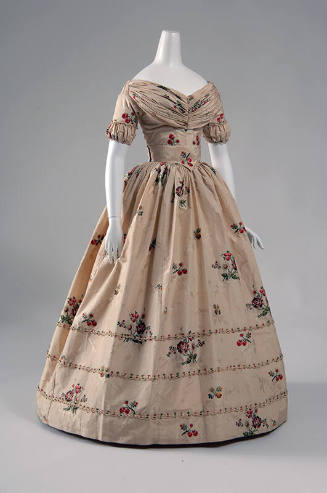 Ivory floor length gown with pink, green and brown floral motifs, wide rouched neckline, short …