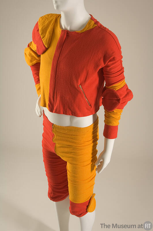 Man’s red and gold color blocked set of long sleeve top with padding on right elbow and left sh…