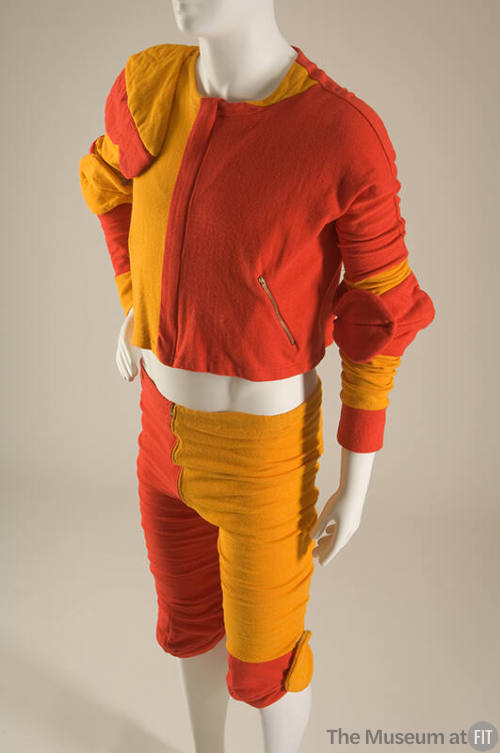 Man’s red and gold color blocked set of long sleeve top with padding on right elbow and left sh…
