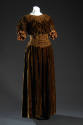 Bown velvet floor length dress with smocked neckline and waist, gathered 3/4 sleeves with silk …