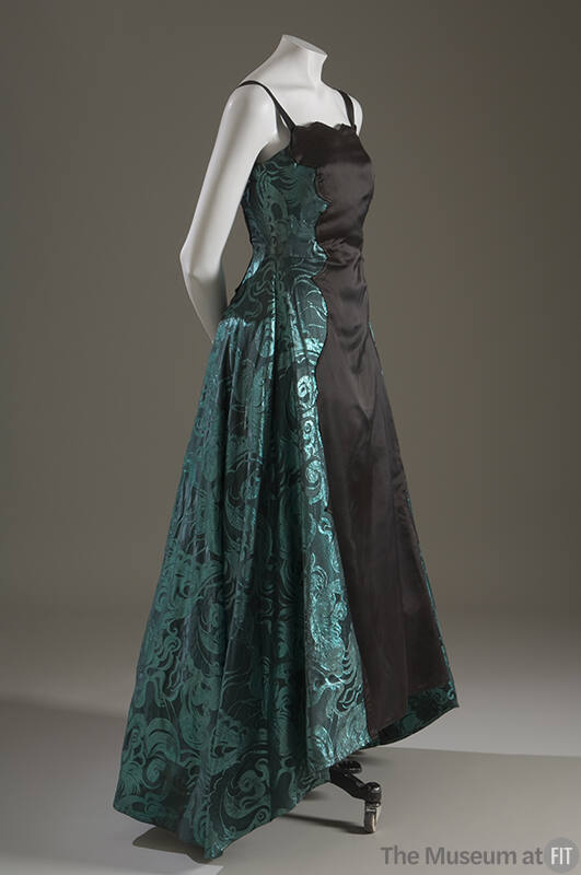 Sleeveless evening gown black taffeta with metallic green brocade side panels and train