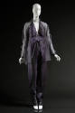 Purple organza jumpsuit with halter neck; matching sheer overblouse.