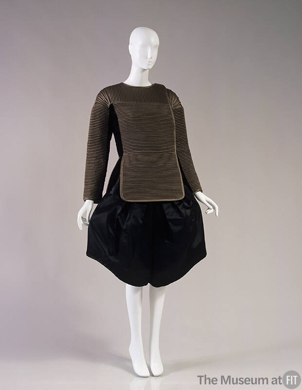 Taupe fitted jacket with peplum panel and wide, knee length black culottes