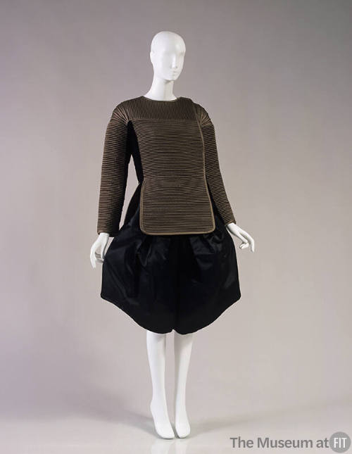 Taupe fitted jacket with peplum panel and wide, knee length black culottes