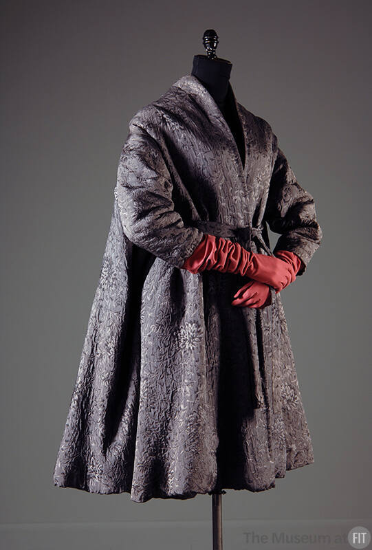 Grey silk flared tent coat with jacquard floral pattern dressed with red elbow length gloves