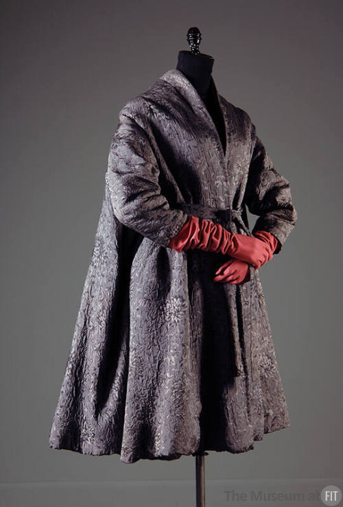 Grey silk flared tent coat with jacquard floral pattern dressed with red elbow length gloves