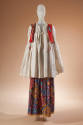 Off-white long sleeve tunic top with cropped red vest with embroidery and purple, yellow, blue …