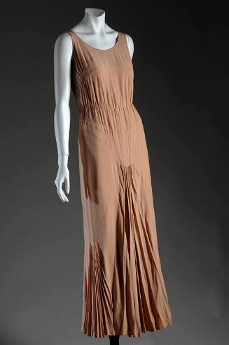 Light brown sleeveless scoop neck evening dress with gathering at waist and seaming to create V…