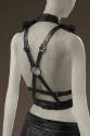 Back detail of black leather multi-buckle harness strap top with center silvertone O ring 