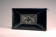 Black leather rectangular clutch bag with floral ornament in center