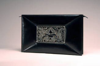 Black leather rectangular clutch bag with floral ornament in center