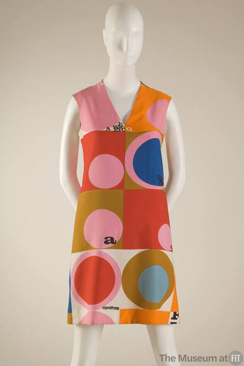 Sleeveless A-line V-neck mini dress with pink, orange, red, ochre, blue and white color block a…