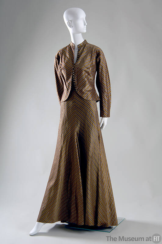 Floor length evening dress in gold, grey, brown and yellow striped silk meeting at center seam …