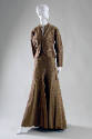 Floor length evening dress in gold, grey, brown and yellow striped silk meeting at center seam …