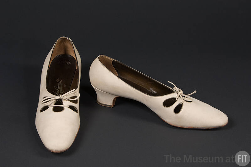 Tan suede tie shoes, tear-drop cut outs, low heel