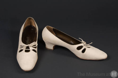 Tan suede tie shoes, tear-drop cut outs, low heel